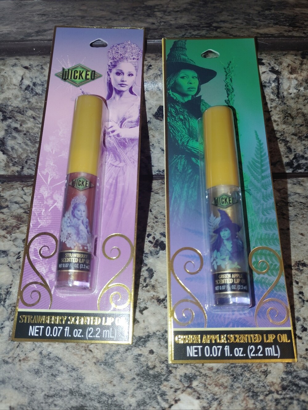 Wicked Good witch and bad witch strawberry scented lip oil and green apple scent